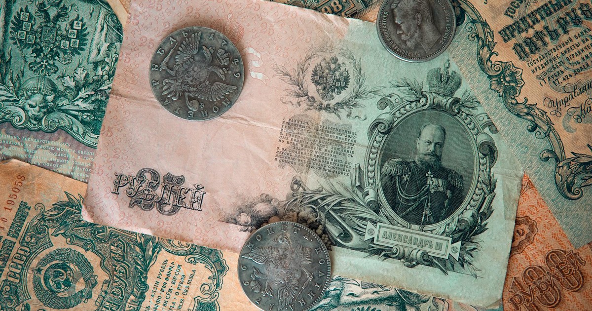 A detailed image of antique Russian banknotes and coins from the Tsarist era, showcasing historical wealth.