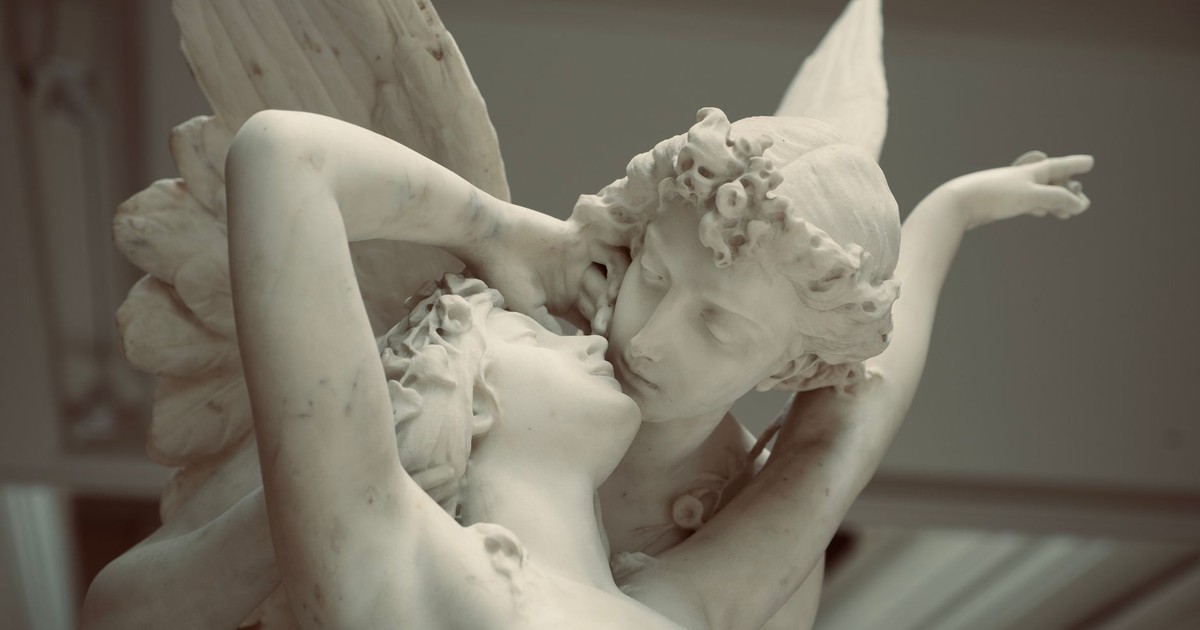 Elegant marble sculpture depicting the tender embrace of Cupid and Psyche.