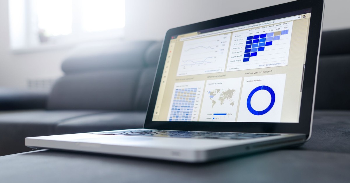 Sleek laptop showcasing data analytics and graphs on the screen in a bright room.