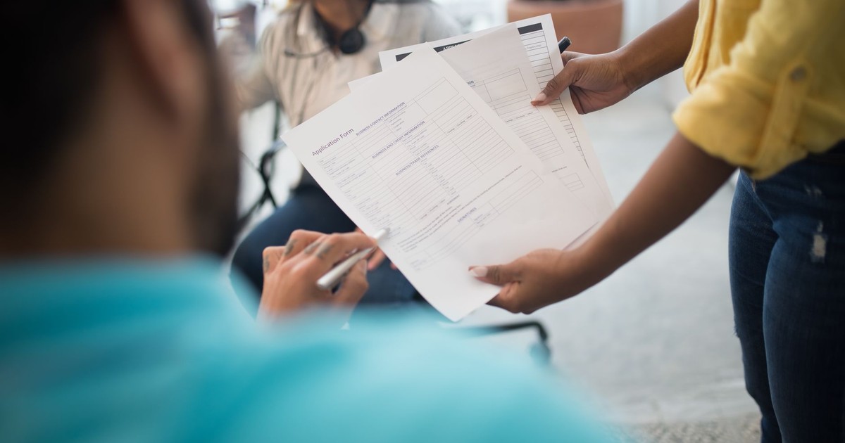 Business professionals analyzing reports during an office meeting.