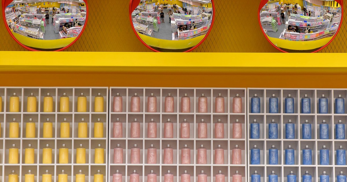 Vibrant warehouse scene with colorful shelves and circular mirrors, capturing a busy shopping environment.