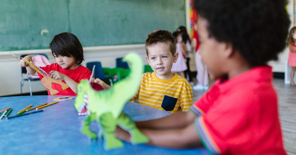 Kids engaging in play and learning activities in a vibrant classroom.