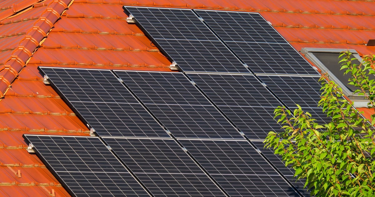 Close-up of solar panels on a red tiled roof in Croatia, highlighting renewable energy.