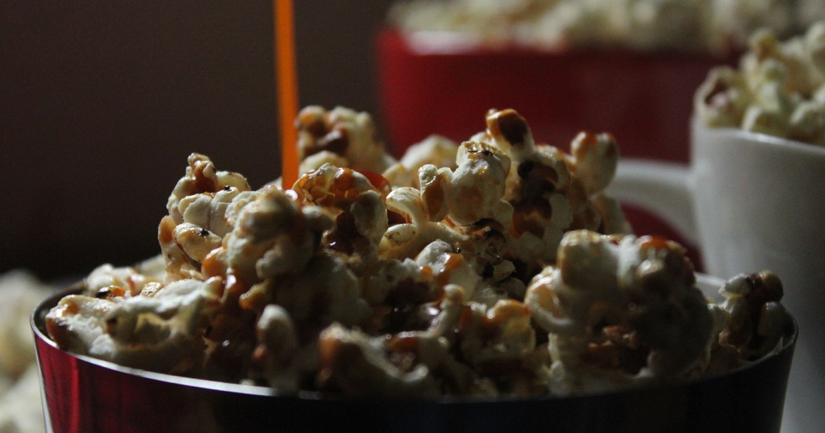 Delicious buttery popcorn in various bowls perfect for movie nights and snacking.