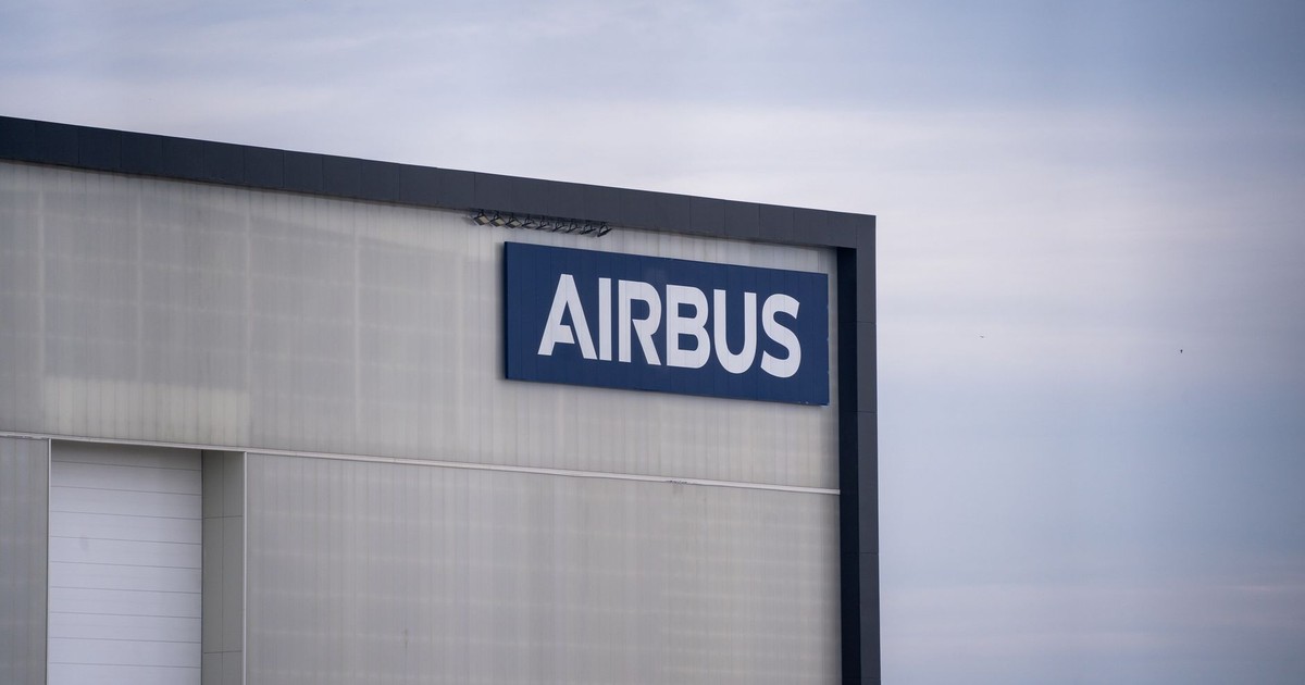 Exterior view of an Airbus factory building with the company logo prominently displayed.