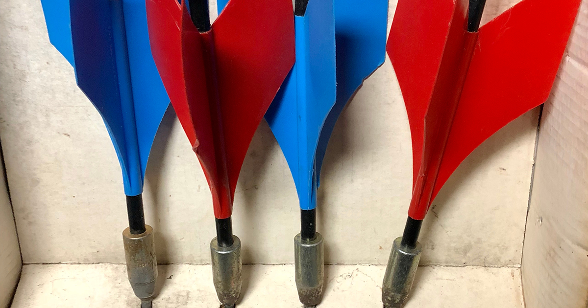 Close-up of old vintage set of red and blue lawn darts