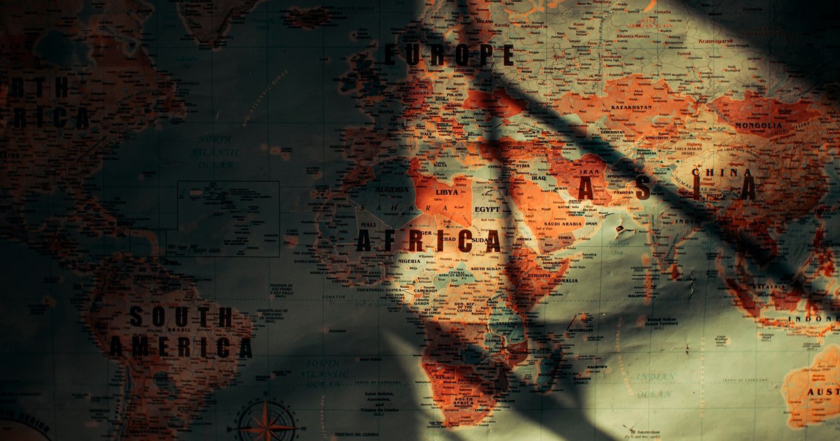 From above of sunlit aged paper world map with continents countries and oceans