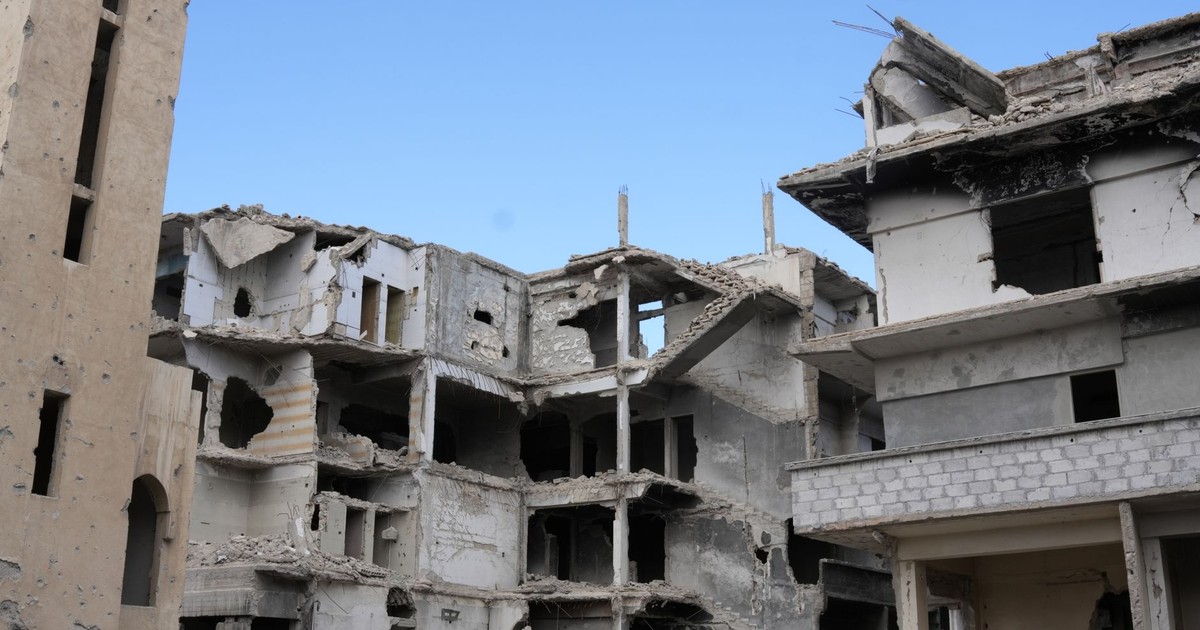 A scene of urban destruction showing damaged buildings in Damascus, Syria.