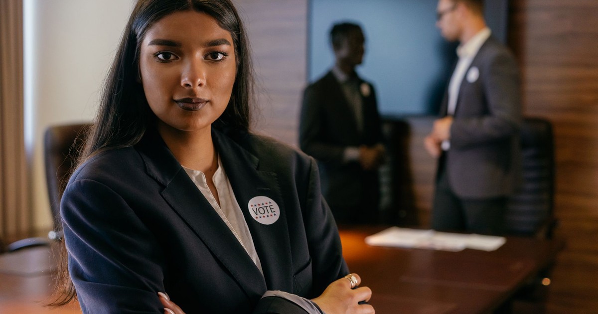 Portrait of a confident woman leader in a formal meeting setting, emphasizing empowerment.