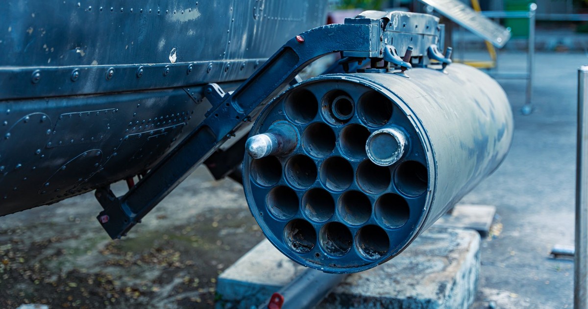 Detailed view of a military rocket launcher showcased outdoors, showcasing industrial design.