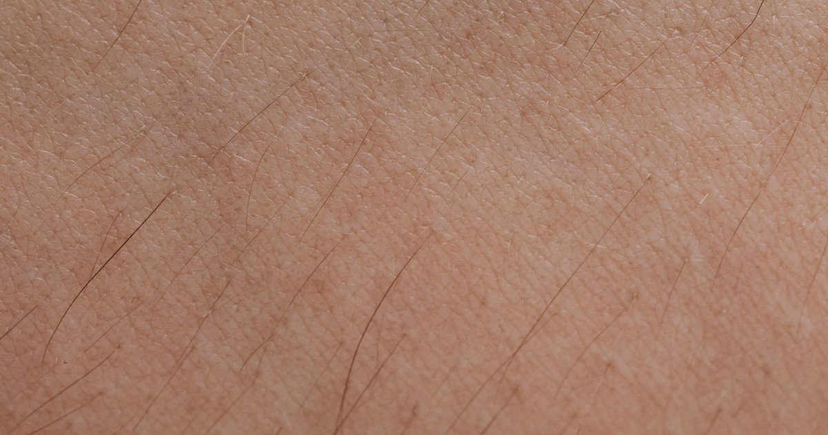 Detailed close-up of human skin texture and hair follicles.