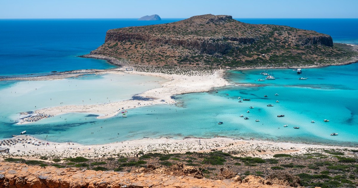 A breathtaking aerial view of Balos Lagoon in Chania, Crete, showcasing clear turquoise waters and sandy shores