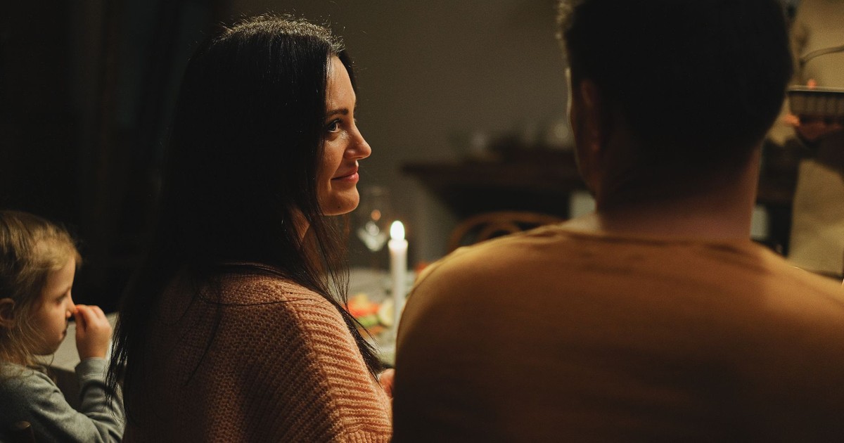 A warm family dinner setting with smiles and shared moments.
