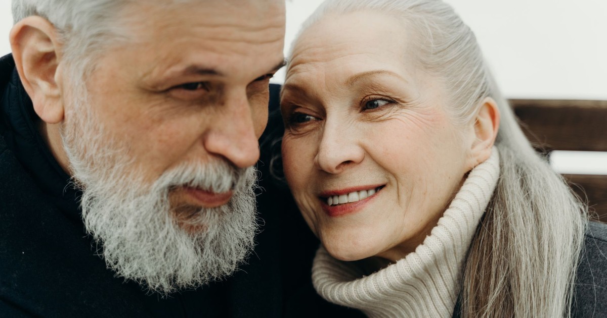 Close-up of a joyful senior couple showing love and togetherness, embracing warmly.