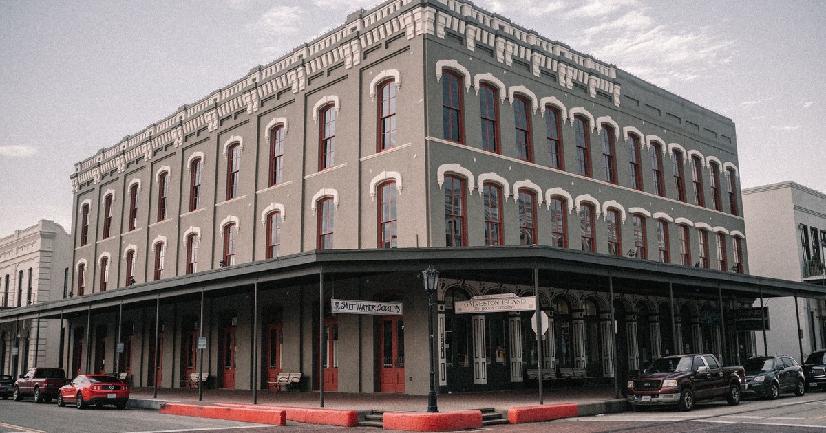A classic historical building facade in Downtown Galveston, Texas on a cloudy day.