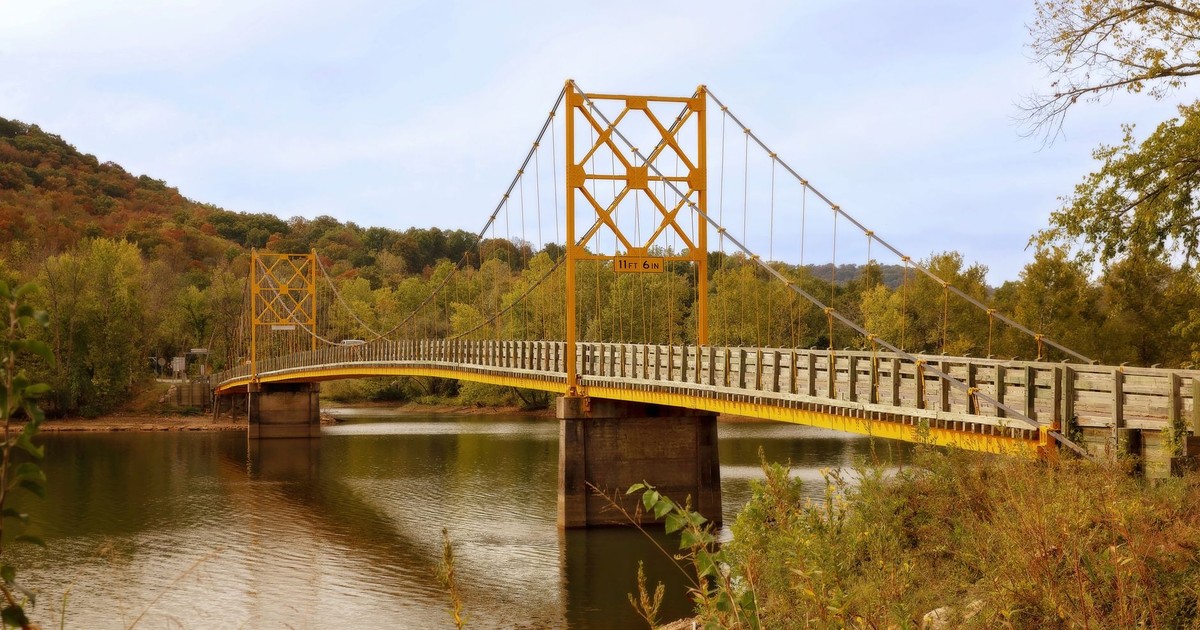 Scenic view of Beaver Bridge over tranquil waters in fall.