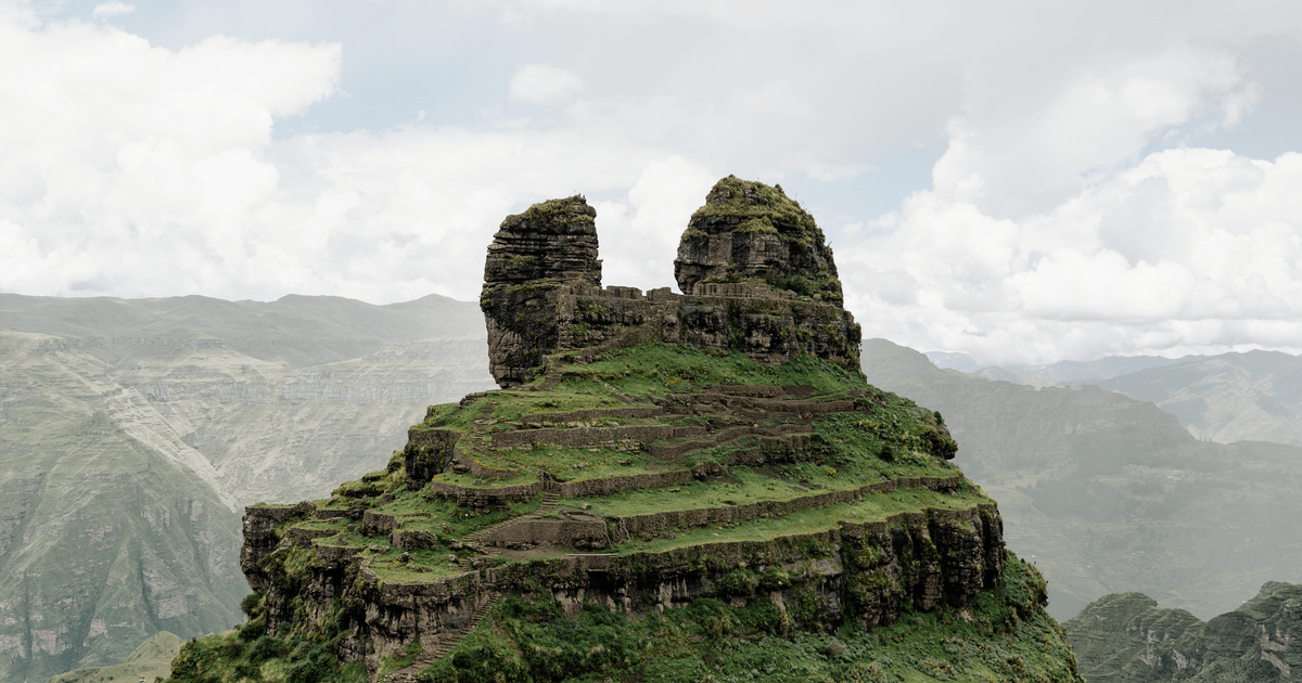 Explore the ancient Waqrapukara fortress in Peru's stunning Andes.