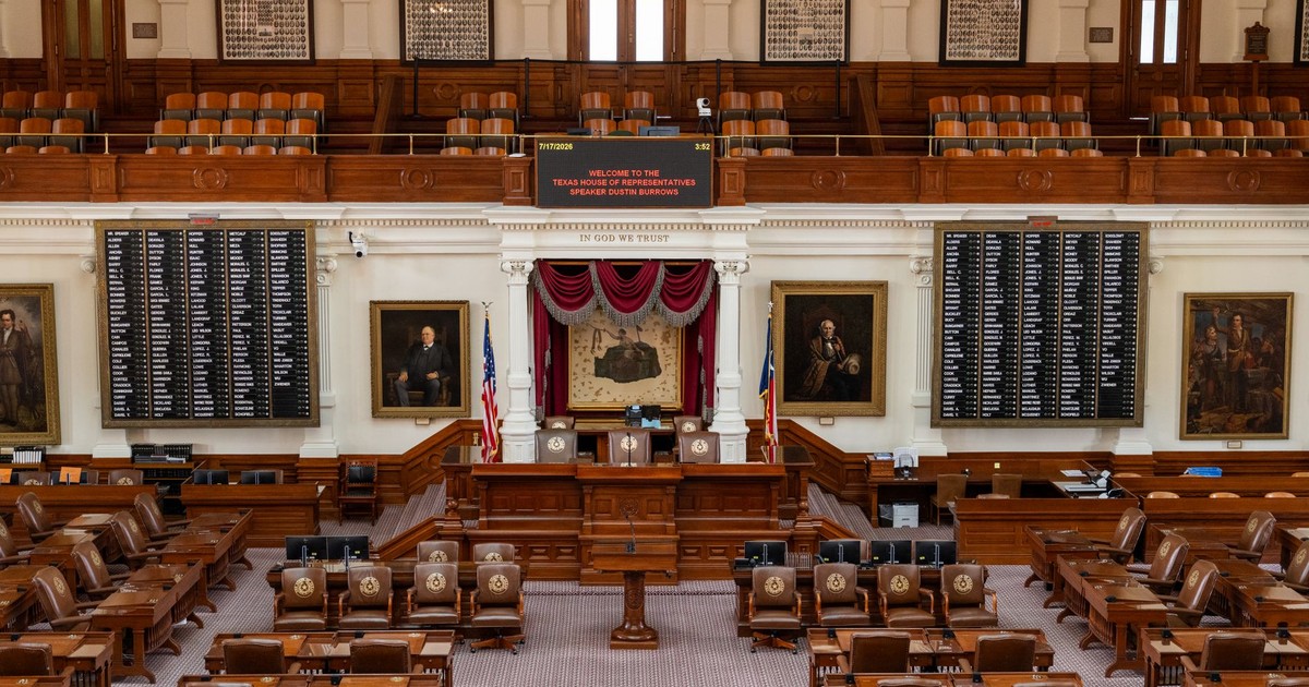 The Texas House of Representatives chamber, featuring legislative seats and historical portraits.