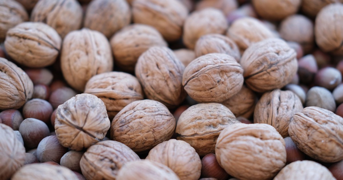 A detailed shot of walnuts and hazelnuts showcasing textures and natural tones.