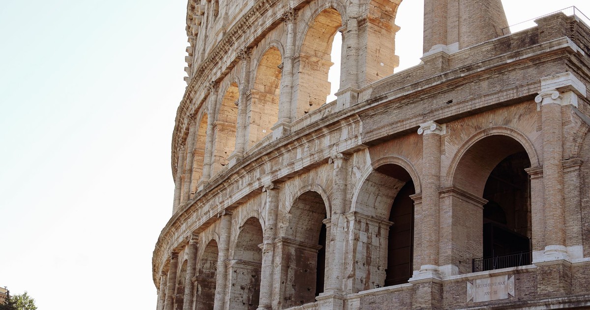 Close-up of the ancient Colosseum in Rome showcasing its majestic Roman architecture.